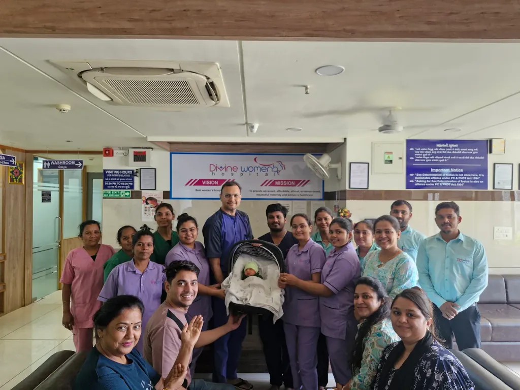 The care team at Divine Women's Hospital with a newborn